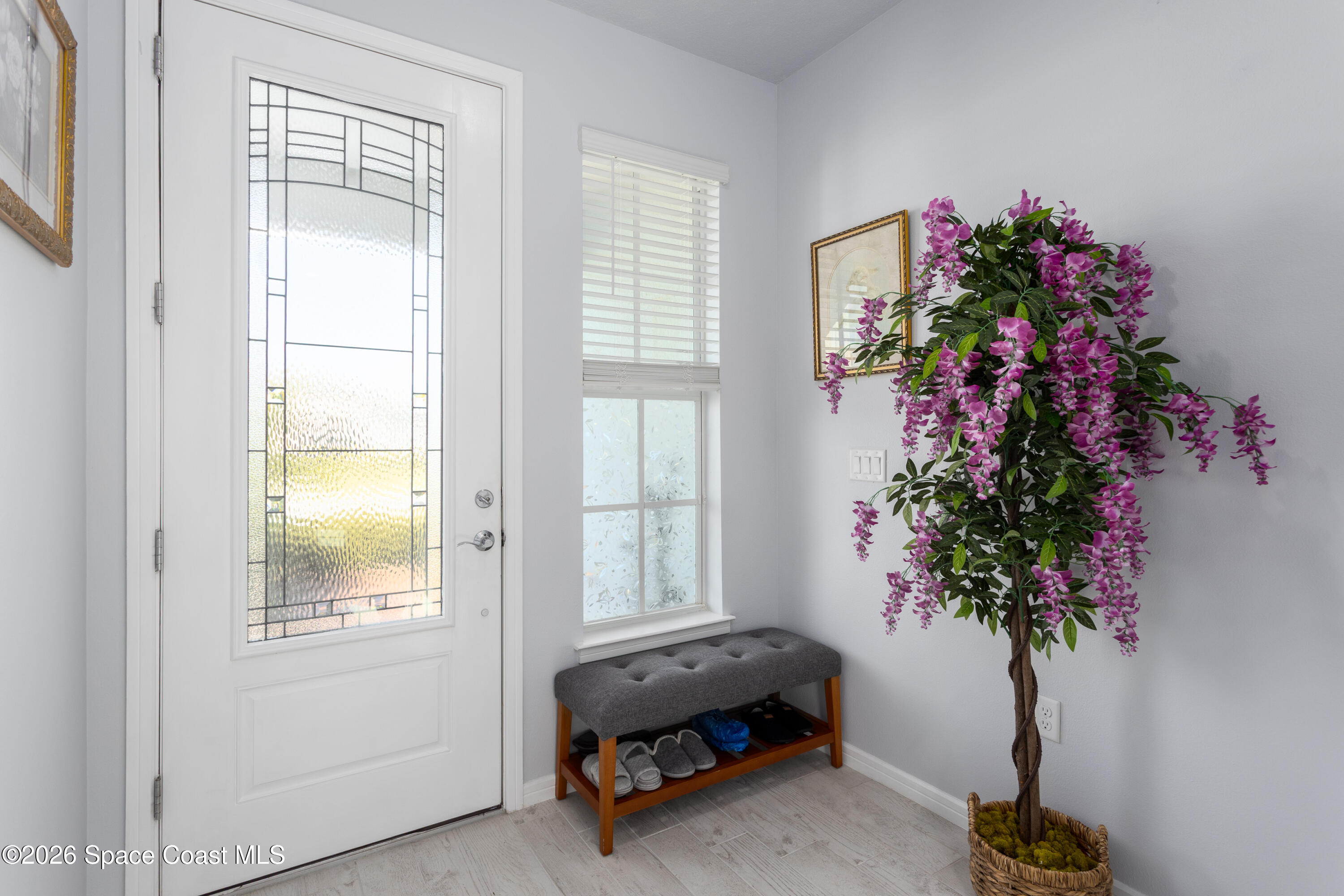 2993 Tidepool Place Melbourne, FL 32940 - Photo 5 of 50 a living room with furniture and a potted plant