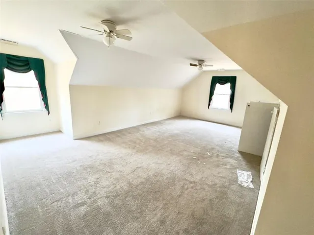 a view of empty room with windows