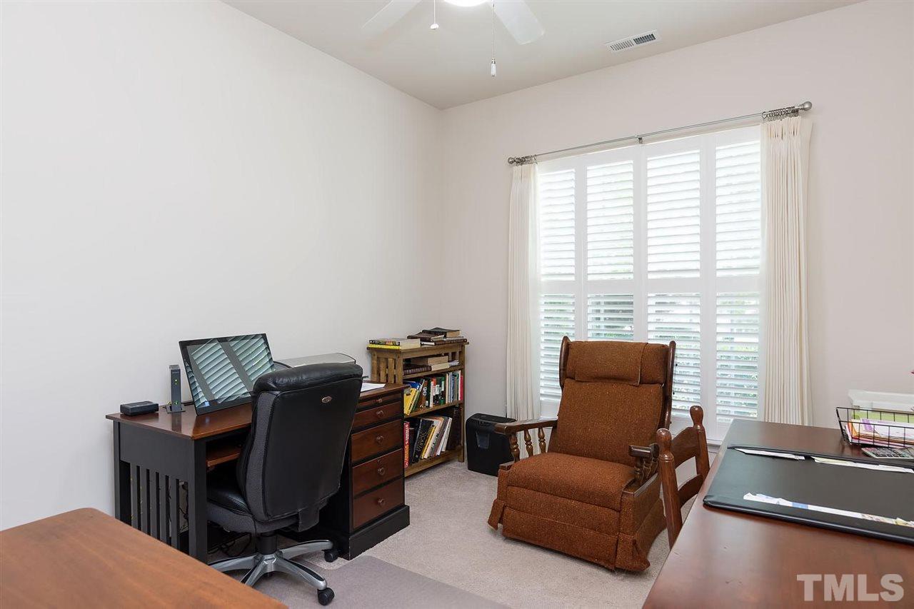3413 Secretariat Way Raleigh, NC 27614 - Photo 11 of 23 a livingroom with workspace and a window