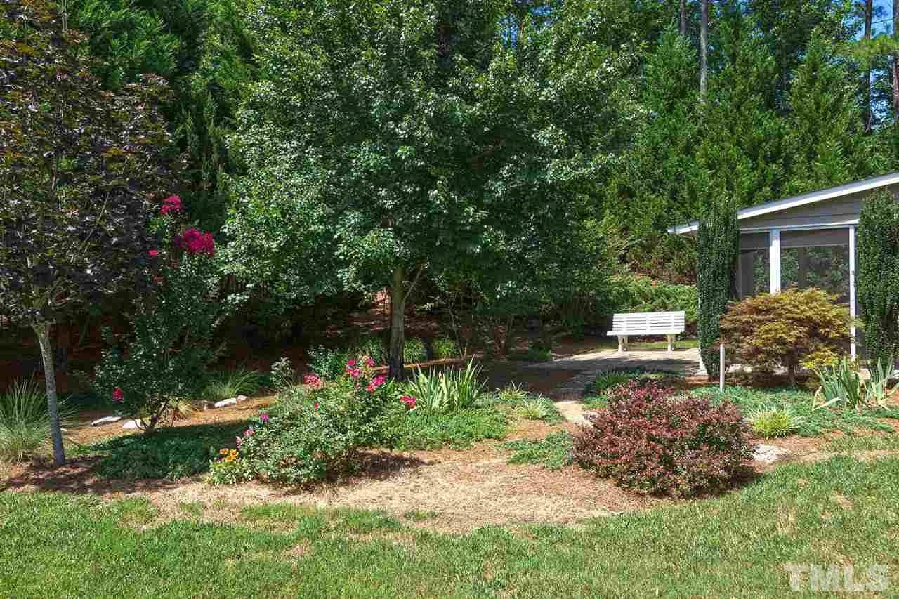 3413 Secretariat Way Raleigh, NC 27614 - Photo 19 of 23 a view of a backyard with garden