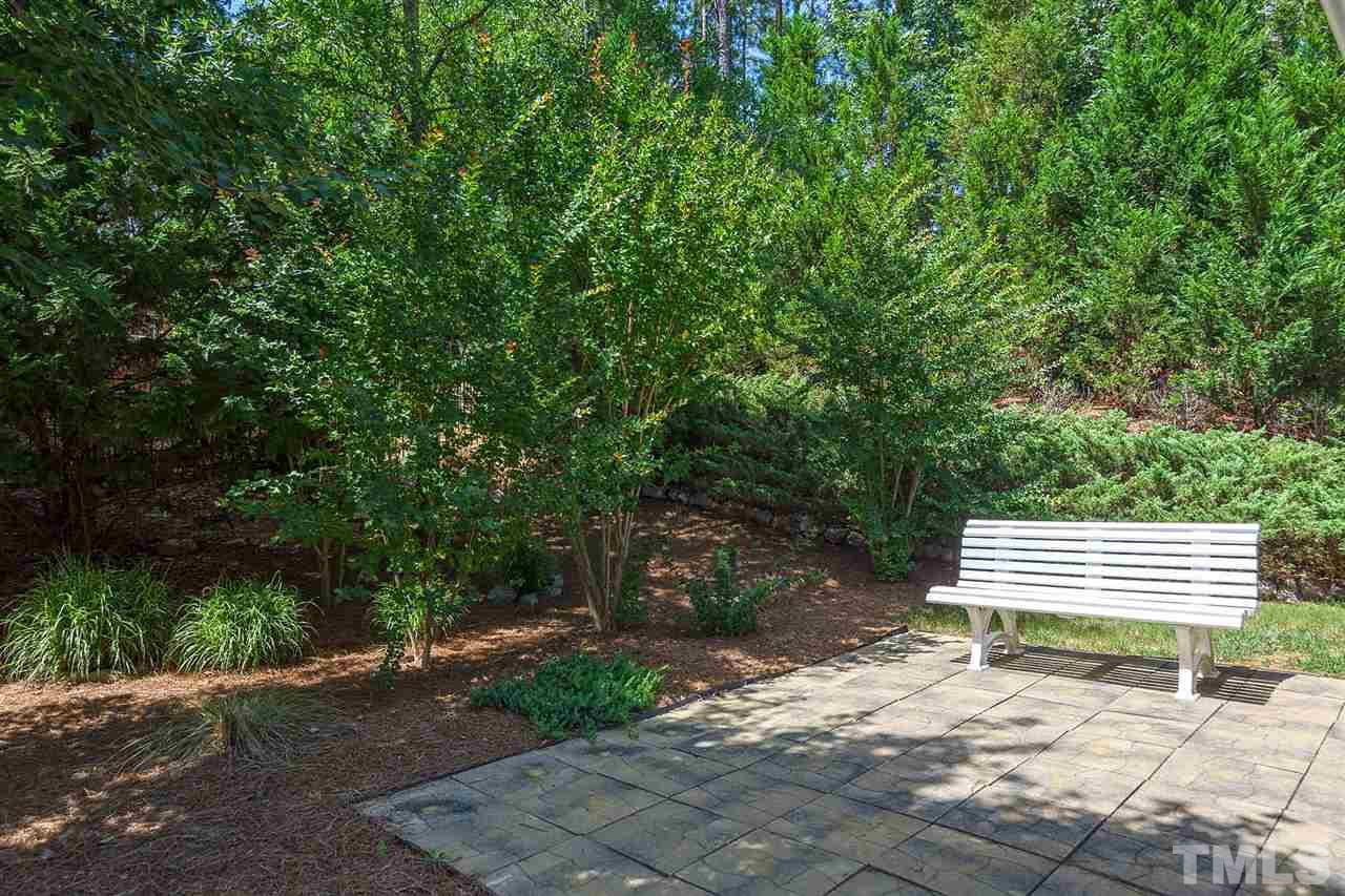 3413 Secretariat Way Raleigh, NC 27614 - Photo 21 of 23 a view of outdoor space with garden and deck