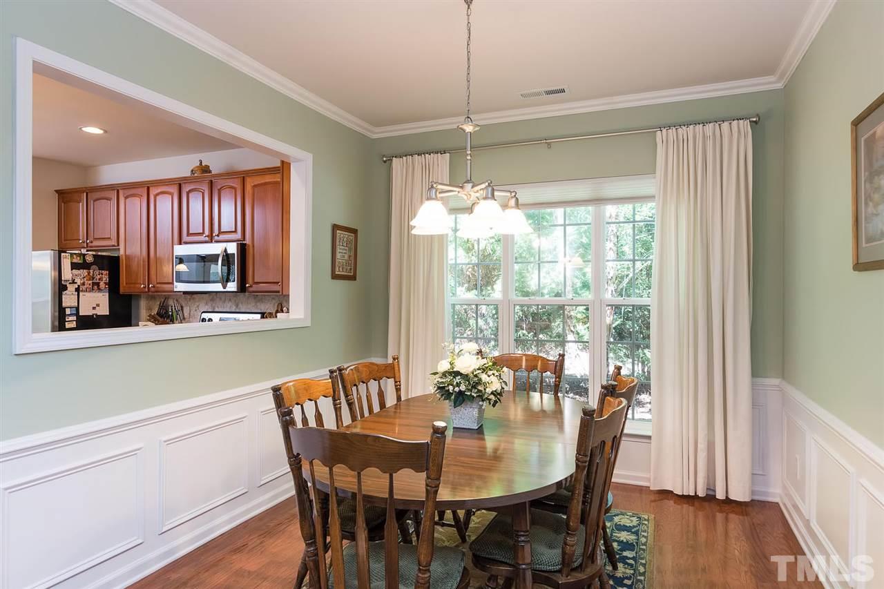 3413 Secretariat Way Raleigh, NC 27614 - Photo 10 of 23 a view of a dining room with furniture window and wooden floor