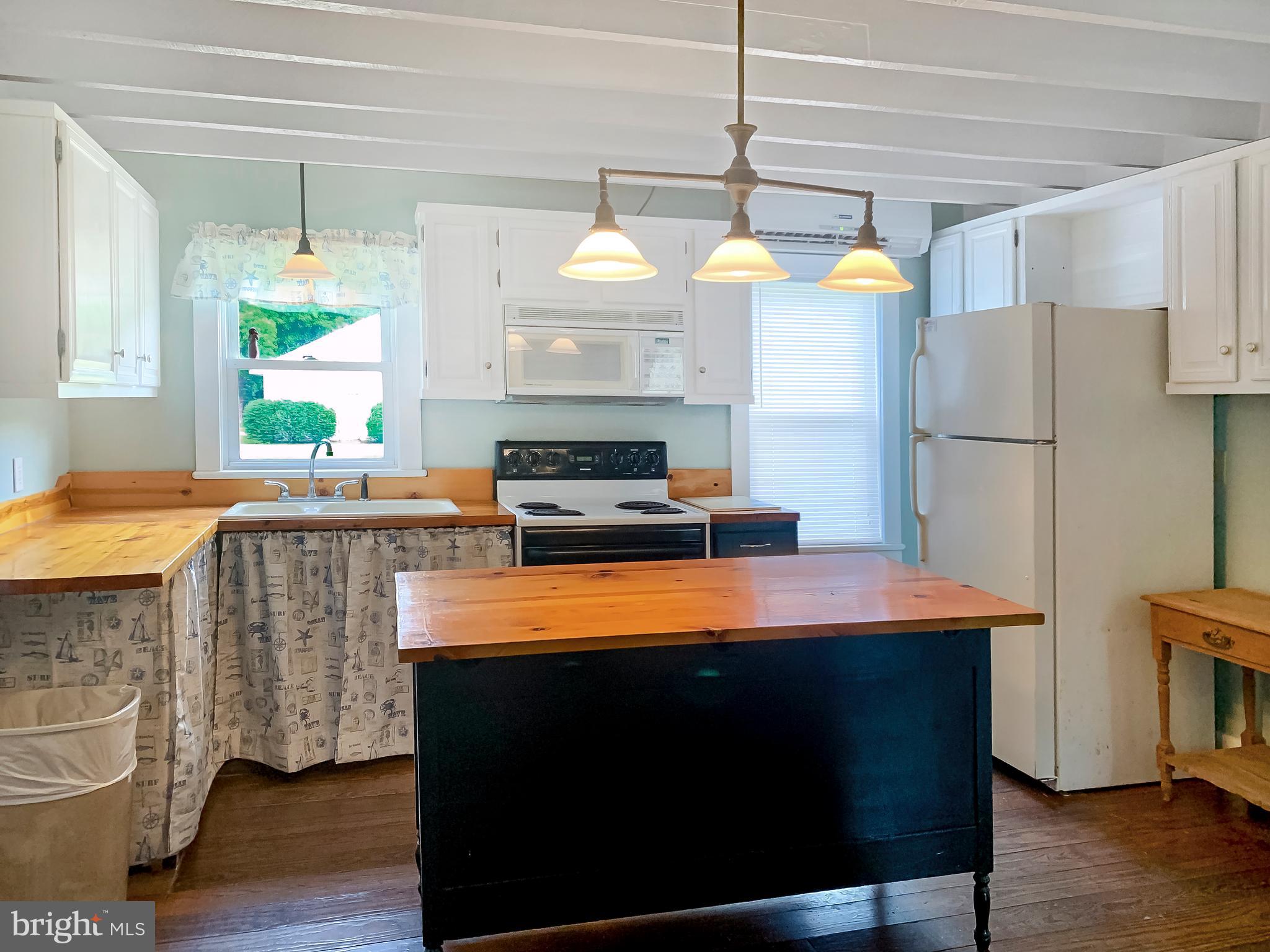 26919 Siloam Road Salisbury, MD 21801 - Photo 7 of 29 Kitchen with exposed beams, large island