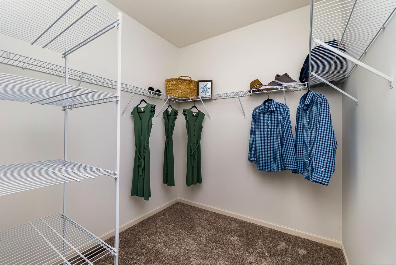 7754 West 103rd Street St. John, IN 46307 - Photo 22 of 39 a view of walk in closet with clothes and shoes
