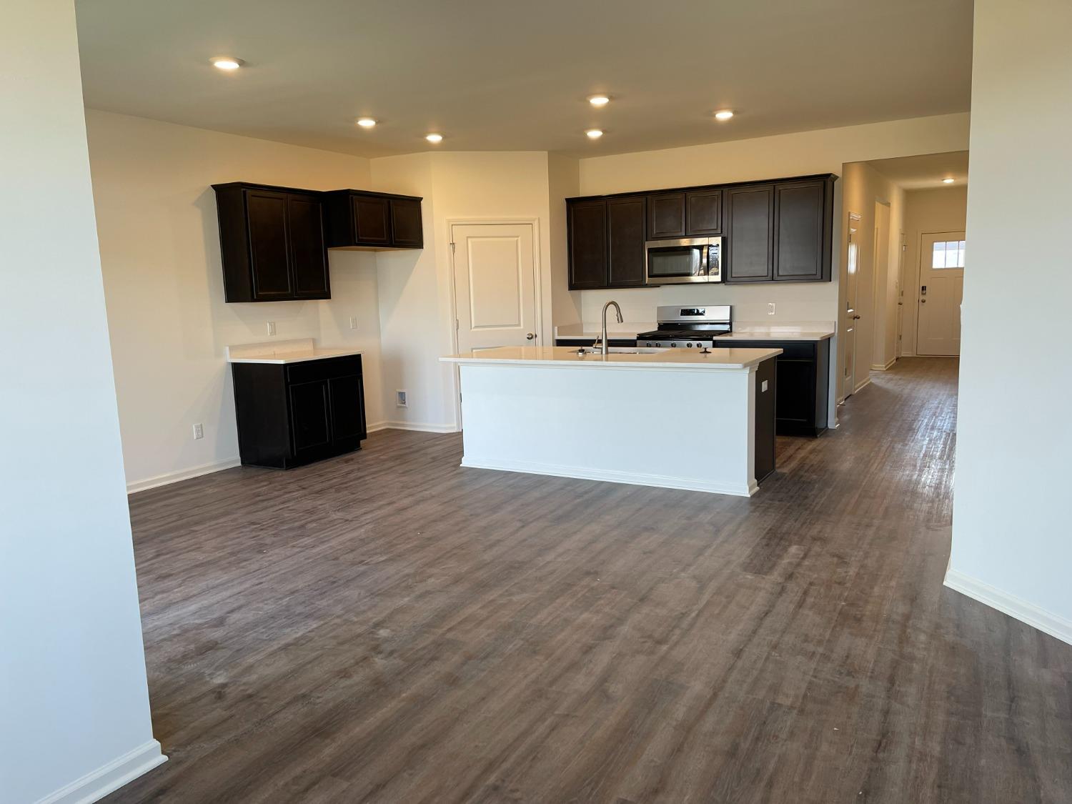 7754 West 103rd Street St. John, IN 46307 - Photo 28 of 39 a view of kitchen with microwave oven and cabinets