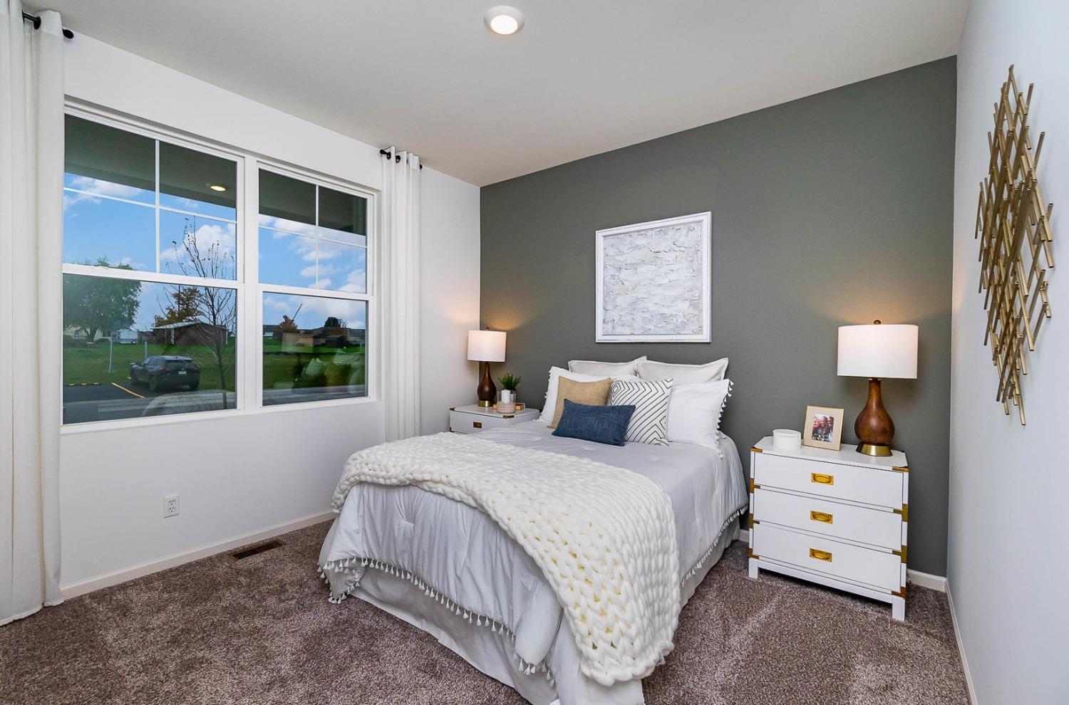 7754 West 103rd Street St. John, IN 46307 - Photo 3 of 39 a bedroom with a bed and a large window