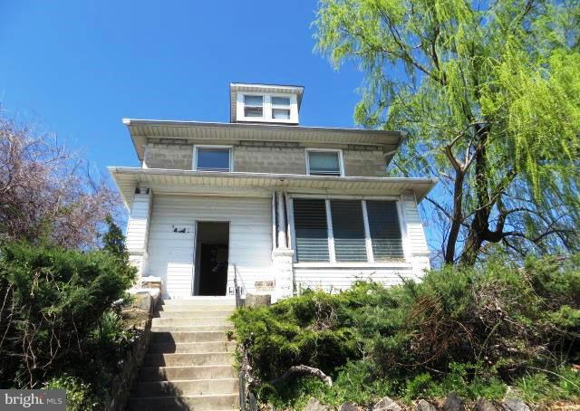 4920 Belair Road Baltimore, MD 21206 - Photo 15 of 16 a front view of a house with a yard