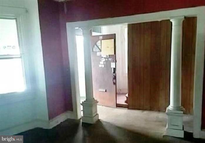 4920 Belair Road Baltimore, MD 21206 - Photo 3 of 16 an empty room with windows