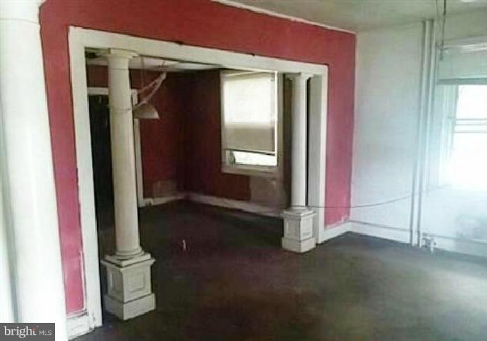 4920 Belair Road Baltimore, MD 21206 - Photo 4 of 16 an empty room with windows