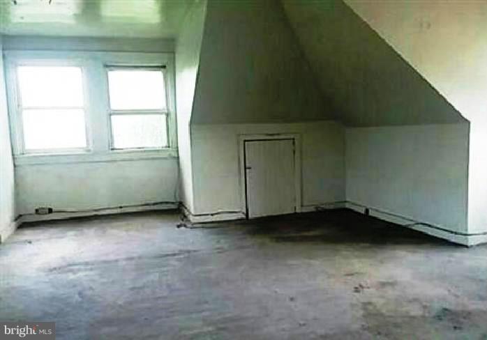 4920 Belair Road Baltimore, MD 21206 - Photo 9 of 16 a view of an empty room with a window