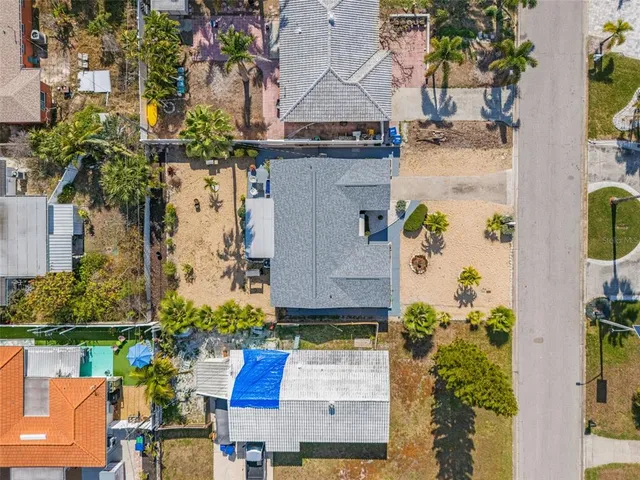 an aerial view of a residential building and lake view