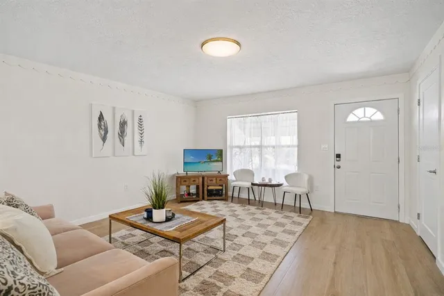 a living room with furniture and a window