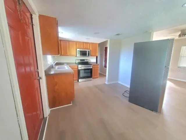 a bathroom with a toilet and a bath tub