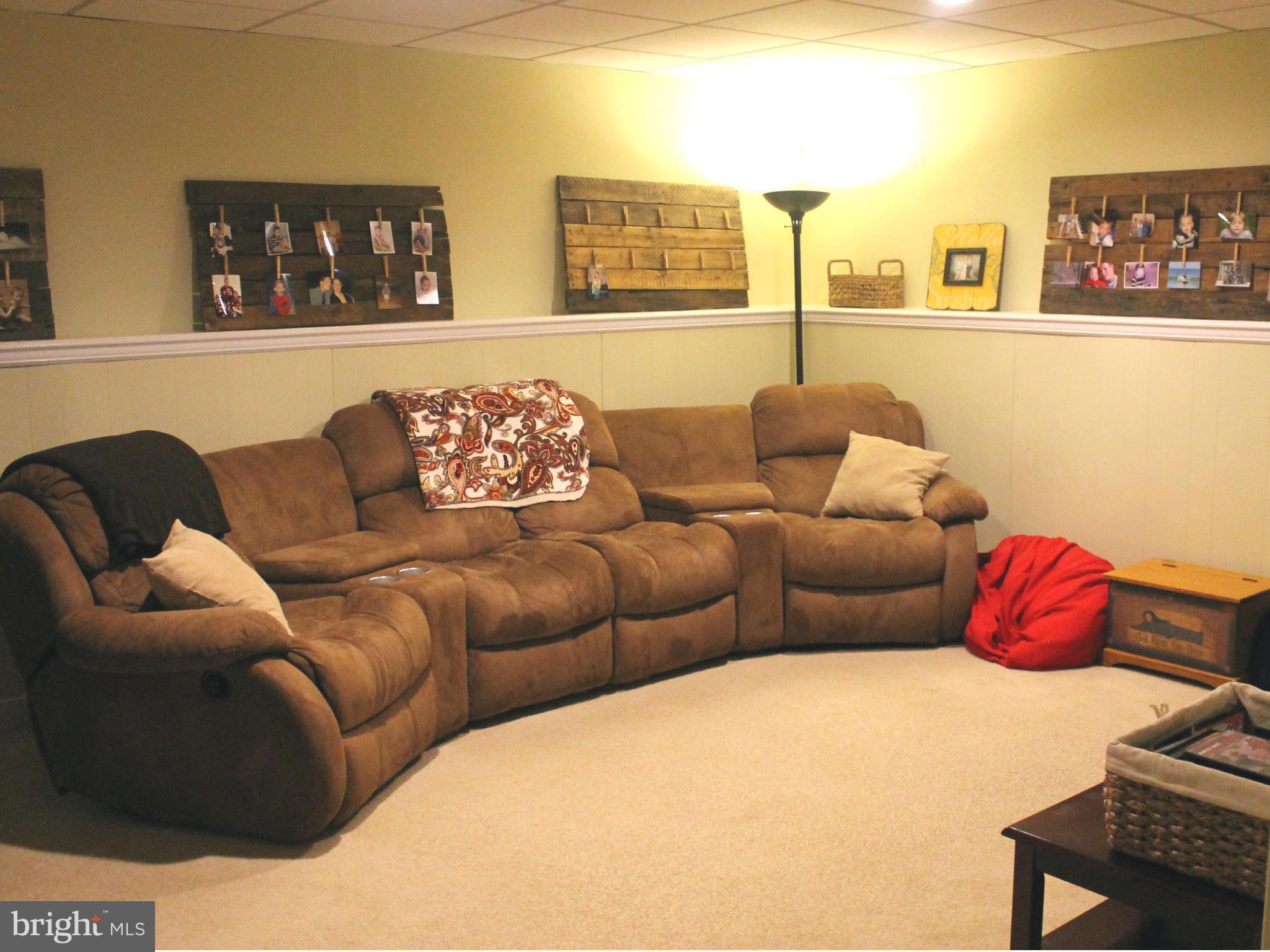 11544 Big Sandy Run Road Lusby, MD 20657 - Photo 11 of 12 a living room with furniture and painting on the wall
