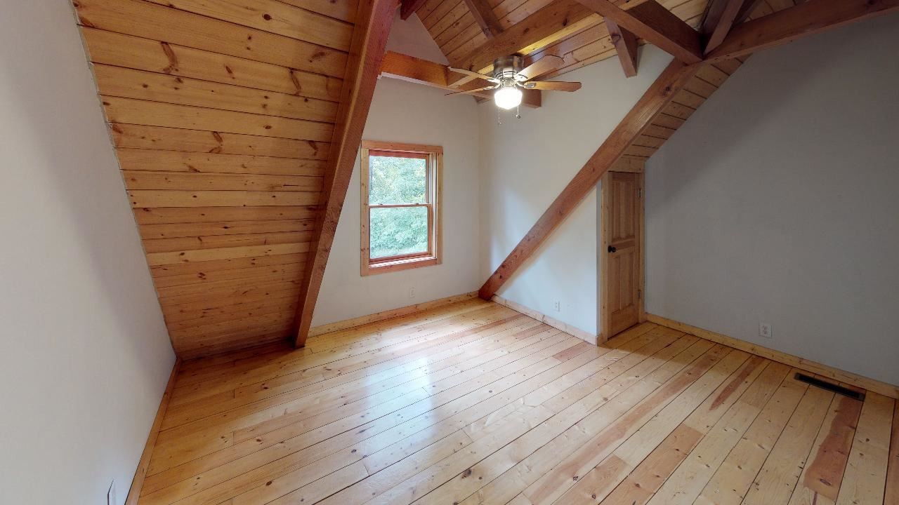 3095 Lower River Road Northwest Georgetown, TN 37336 - Photo 15 of 25 an empty room with wooden floor fan and windows