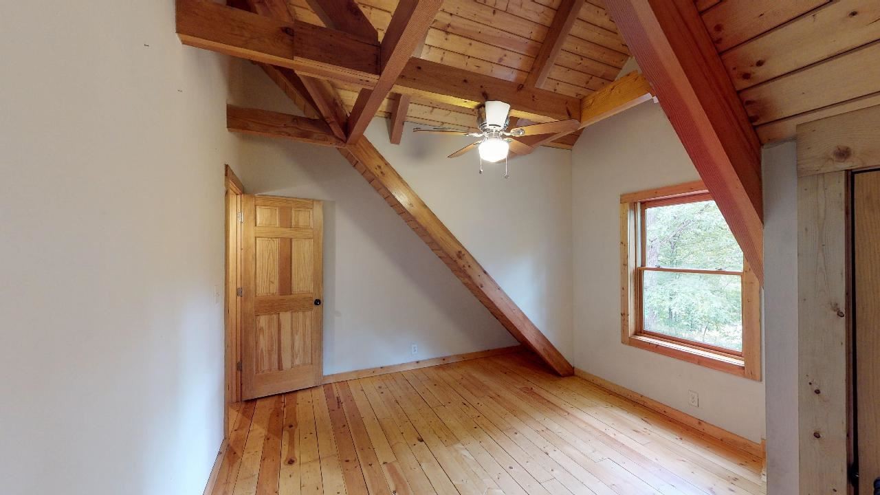 3095 Lower River Road Northwest Georgetown, TN 37336 - Photo 16 of 25 a view of an empty room with wooden floor and windows