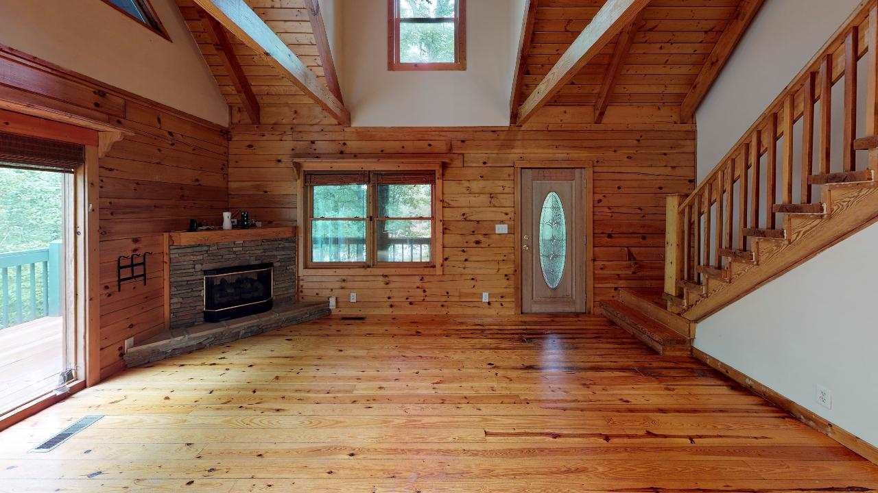 3095 Lower River Road Northwest Georgetown, TN 37336 - Photo 5 of 25 a view of a livingroom with wooden floor a fireplace and window