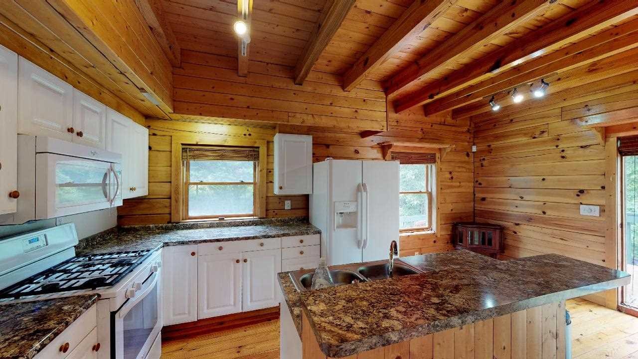 3095 Lower River Road Northwest Georgetown, TN 37336 - Photo 6 of 25 a kitchen with stove and cabinets