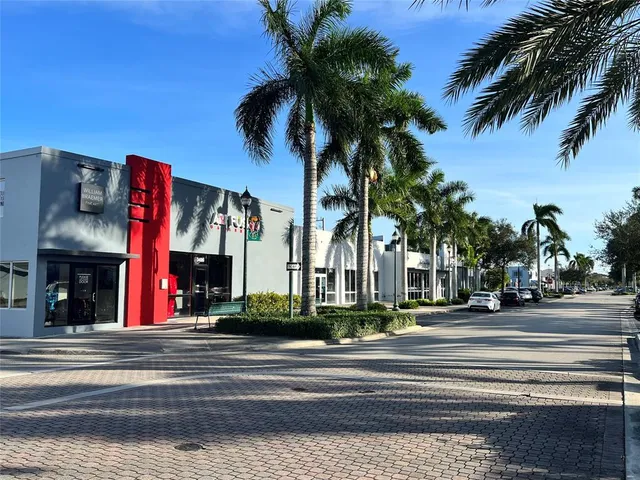 a view of a building with a palm tree