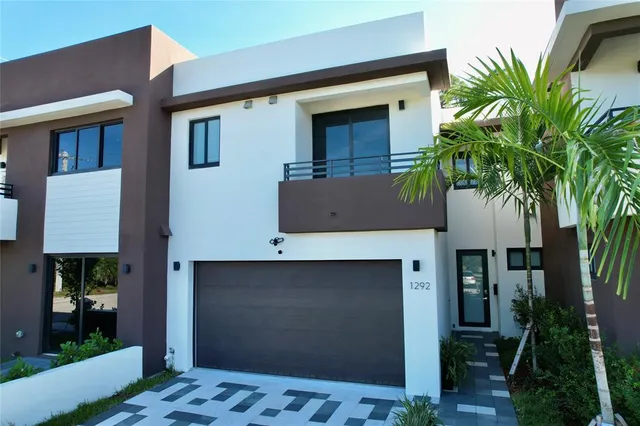 a front view of a house with yard