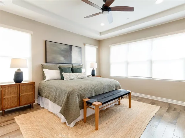 a spacious bedroom with a large bed and a window