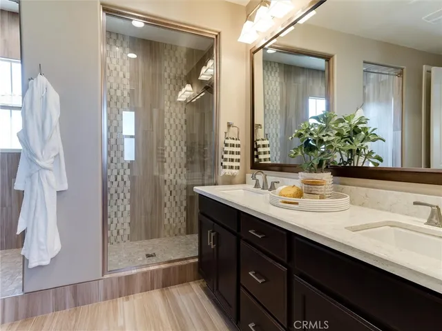 a bathroom with a sink double vanity and a mirror