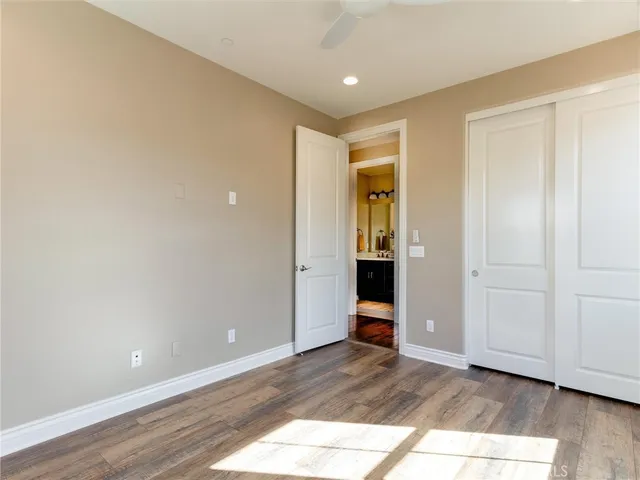a white bath tub sitting next to a white toilet and a shower