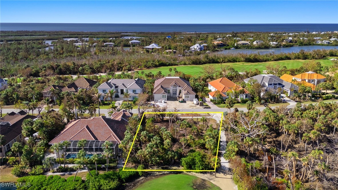 2310 Wulfert Road Sanibel, FL 33957 - Photo 10 of 14 an aerial view of a house with a lake view