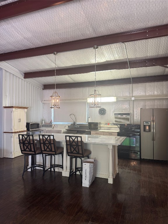 16375 Grand Flower Road Plantersville, TX 77363 - Photo 11 of 25 a kitchen with a table chairs and wooden floor