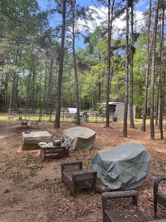 16375 Grand Flower Road Plantersville, TX 77363 - Photo 18 of 25 a view of a park with large trees