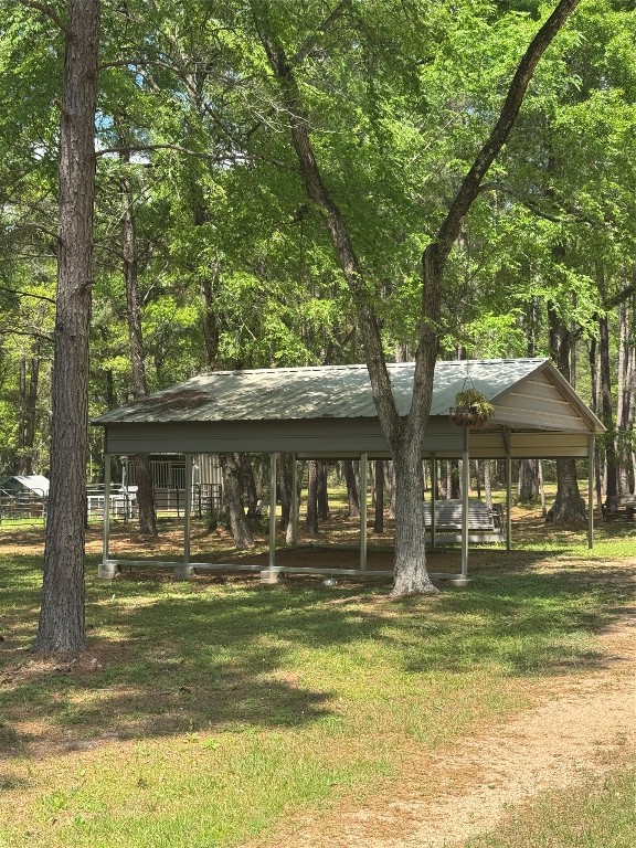 16375 Grand Flower Road Plantersville, TX 77363 - Photo 4 of 25 a front view of a house with a swimming pool