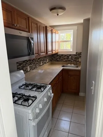 a kitchen with a stove and a sink
