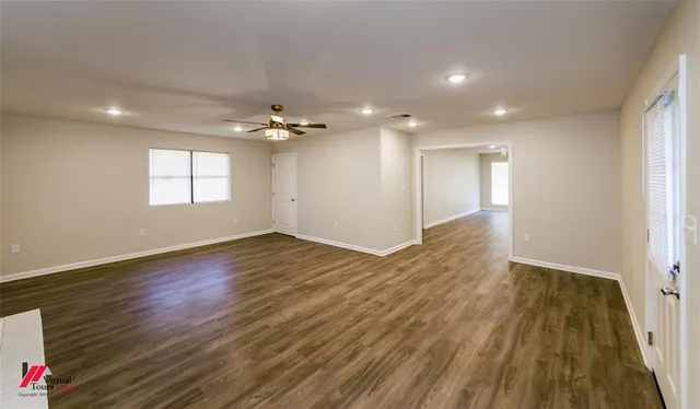 a view of an empty room and window