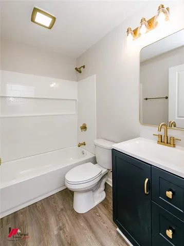 a bathroom with a sink a toilet and a tub