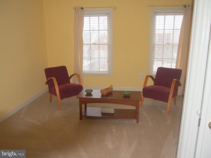 14407 Bubbling Spring Road Boyds, MD 20841 - Photo 1 of 30 a living room with furniture and a window