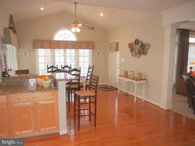 14407 Bubbling Spring Road Boyds, MD 20841 - Photo 3 of 30 a very nice looking dining room with a large dining table and a large window