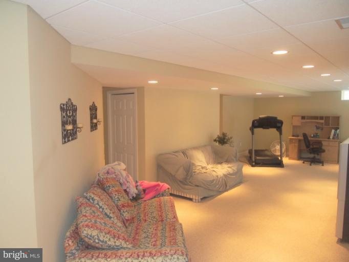 14407 Bubbling Spring Road Boyds, MD 20841 - Photo 23 of 30 a bedroom with furniture and a chandelier