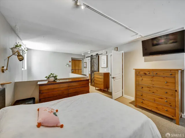 a bed room with a bed and furniture