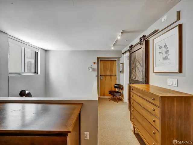 a view of living room with furniture and window