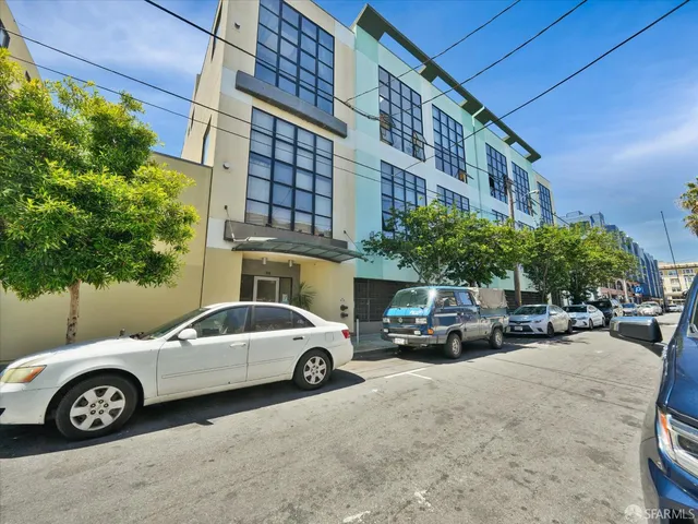 a view of a car parked in front of a building