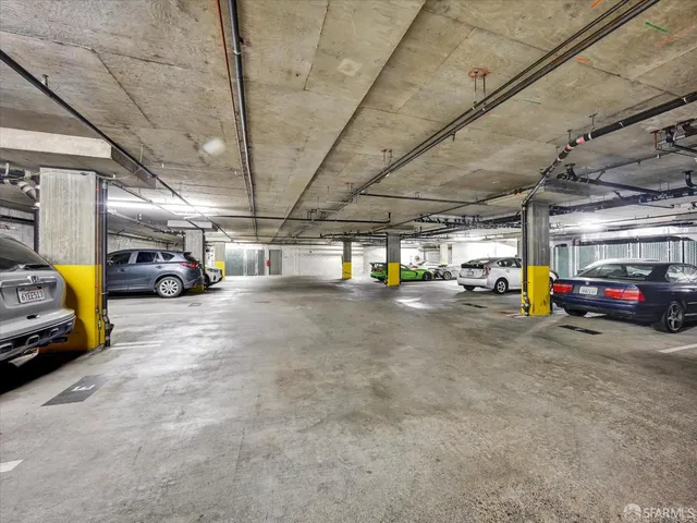a view of parking garage with cars