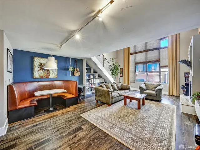 a living room with furniture and a rug