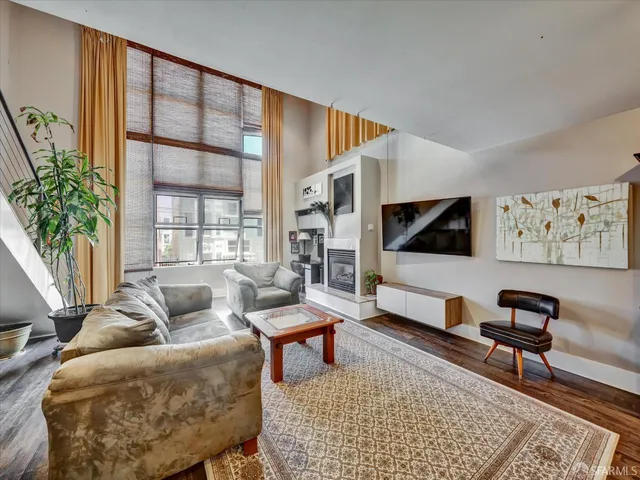 a living room with furniture and a rug