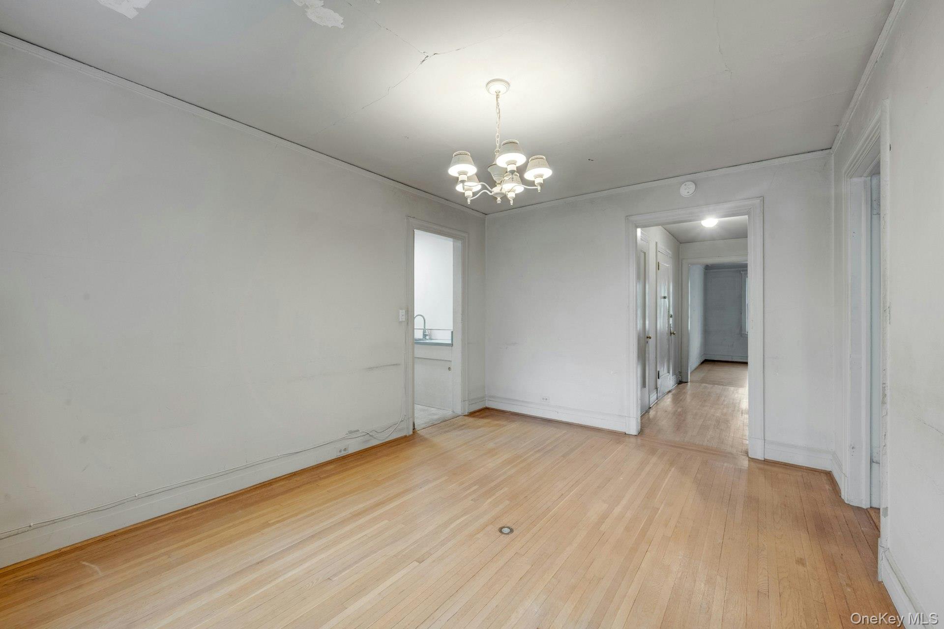 3 Alden Place, Unit 1A Bronxville, NY 10708 - Photo 11 of 29 an empty room with wooden floor and windows