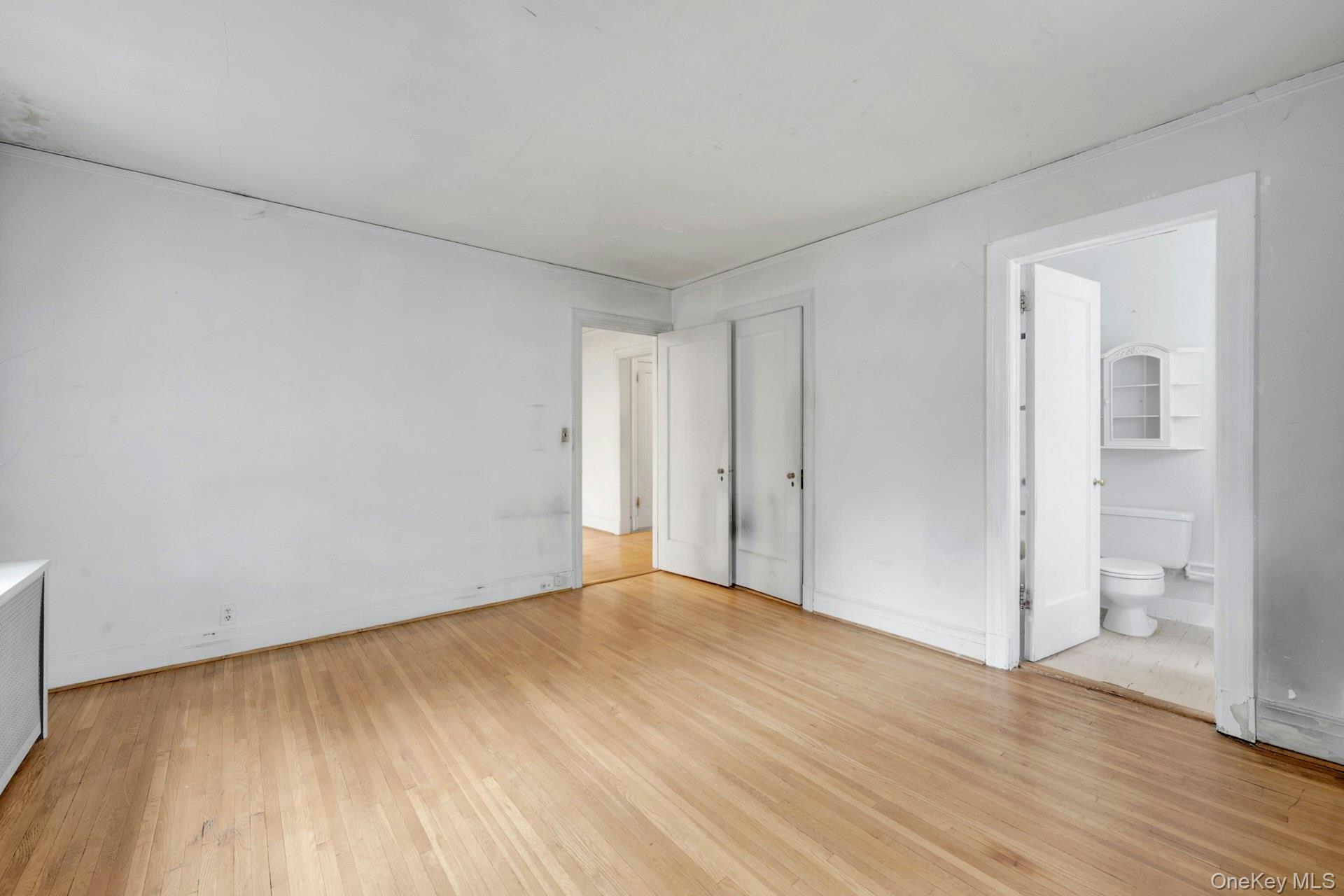 3 Alden Place, Unit 1A Bronxville, NY 10708 - Photo 20 of 29 a view of an empty room with wooden floor and a window