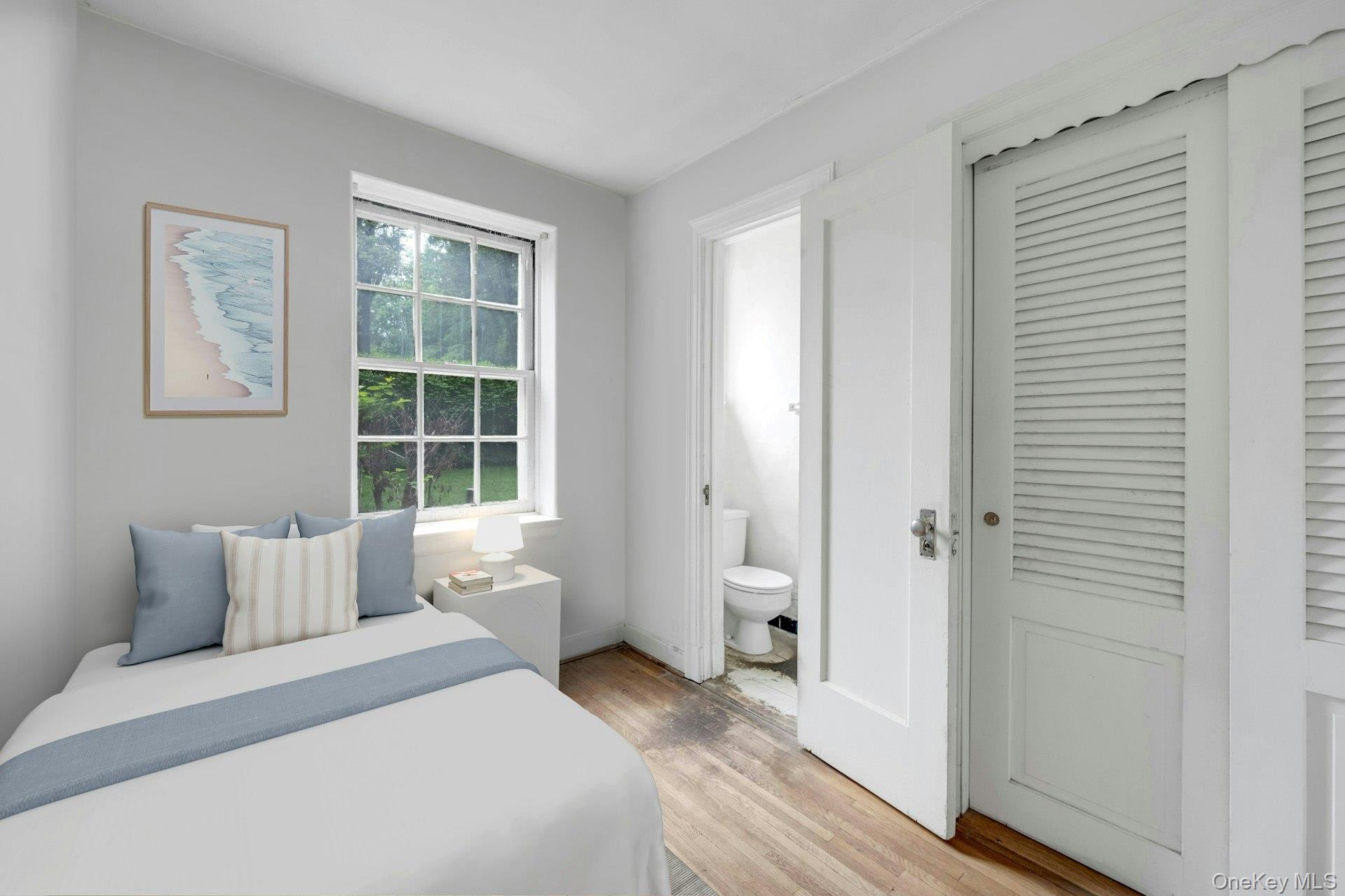 3 Alden Place, Unit 1A Bronxville, NY 10708 - Photo 26 of 29 a bedroom with a bed and wooden floor