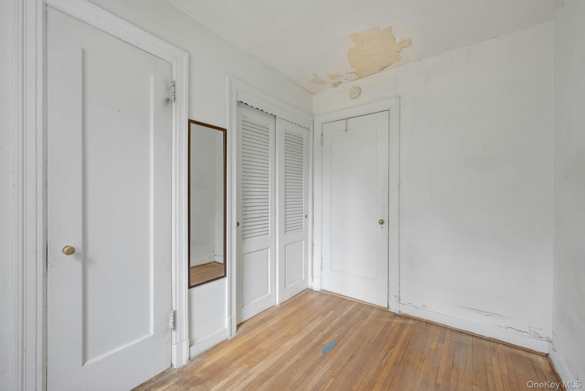 3 Alden Place, Unit 1A Bronxville, NY 10708 - Photo 27 of 29 a view of hallway with wooden floor