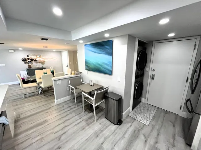 a spacious bedroom with a bed and a flat screen tv