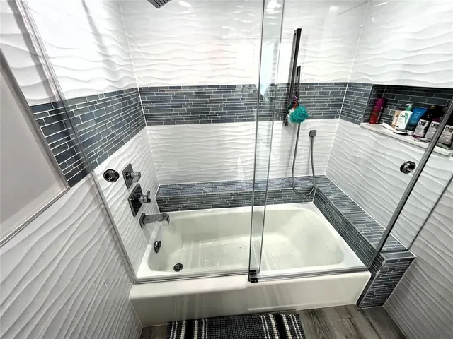 a bedroom with a bed and a mirror