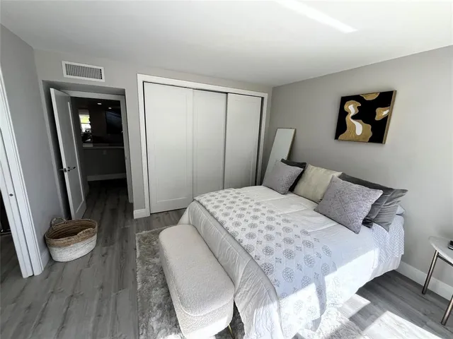 a bathroom with a sink toilet and mirror